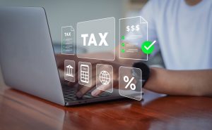 Businessman using Laptop for Taxes